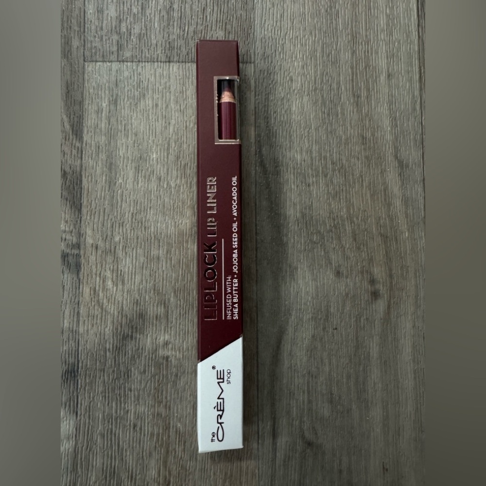 The Creme Shop Lip Lock Lip Liner shade of‎ plum . New, Boxed in plum coloring